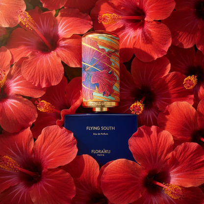 Floraïku Flying South perfume styled in a sunlit tropical hibiscus setting