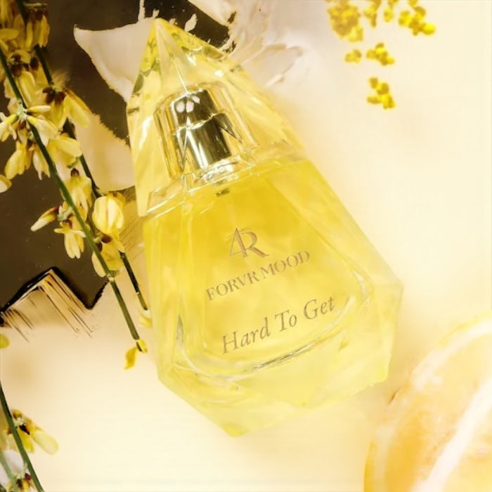 FORVR Mood Hard to Get perfume sample – bright citrus and vanilla notes styled in a light, feminine setting.
