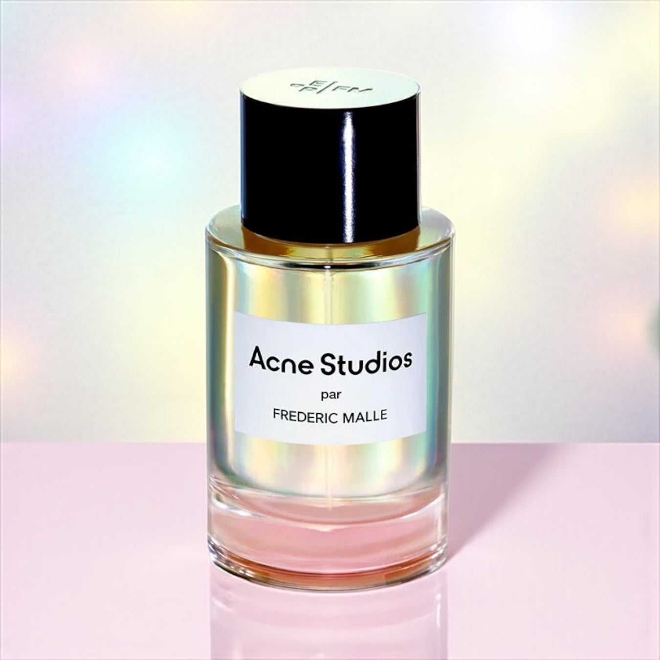 Frédéric Malle Acne Studios perfume sample – rose, peach and sandalwood notes styled in a minimal neutral-toned setting.