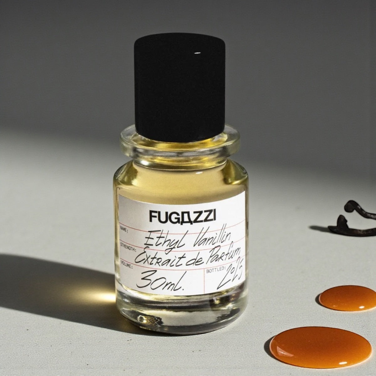 Fugazzi Ethyl Vanillin perfume sample styled with vanilla pods and caramel tones to highlight its sweet warm character.