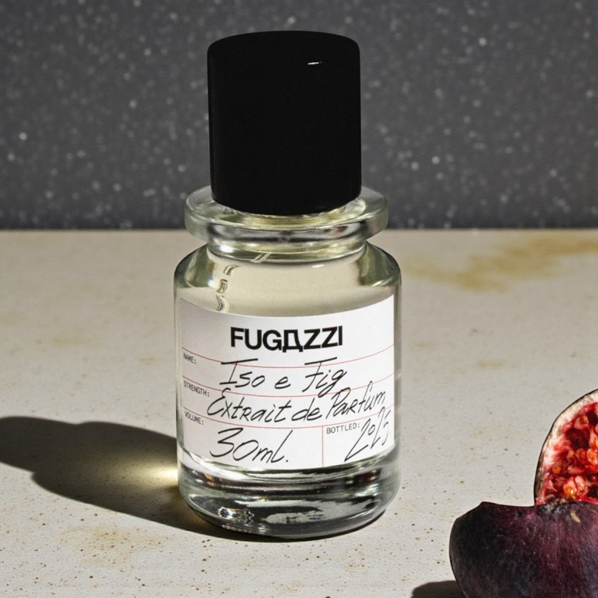 Fugazzi Iso E Fig perfume sample styled with fresh figs to highlight its bright fruity character.