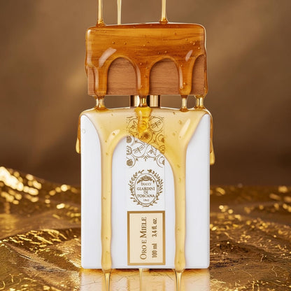 Giardini di Toscana Oro e Miele perfume styled in a warm golden setting with honey