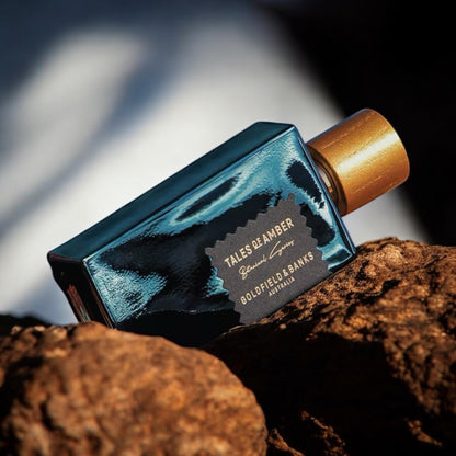 Goldfield & Banks Tales of Amber perfume sample - elegant ambergris and orris scent in a warm, sophisticated setting.