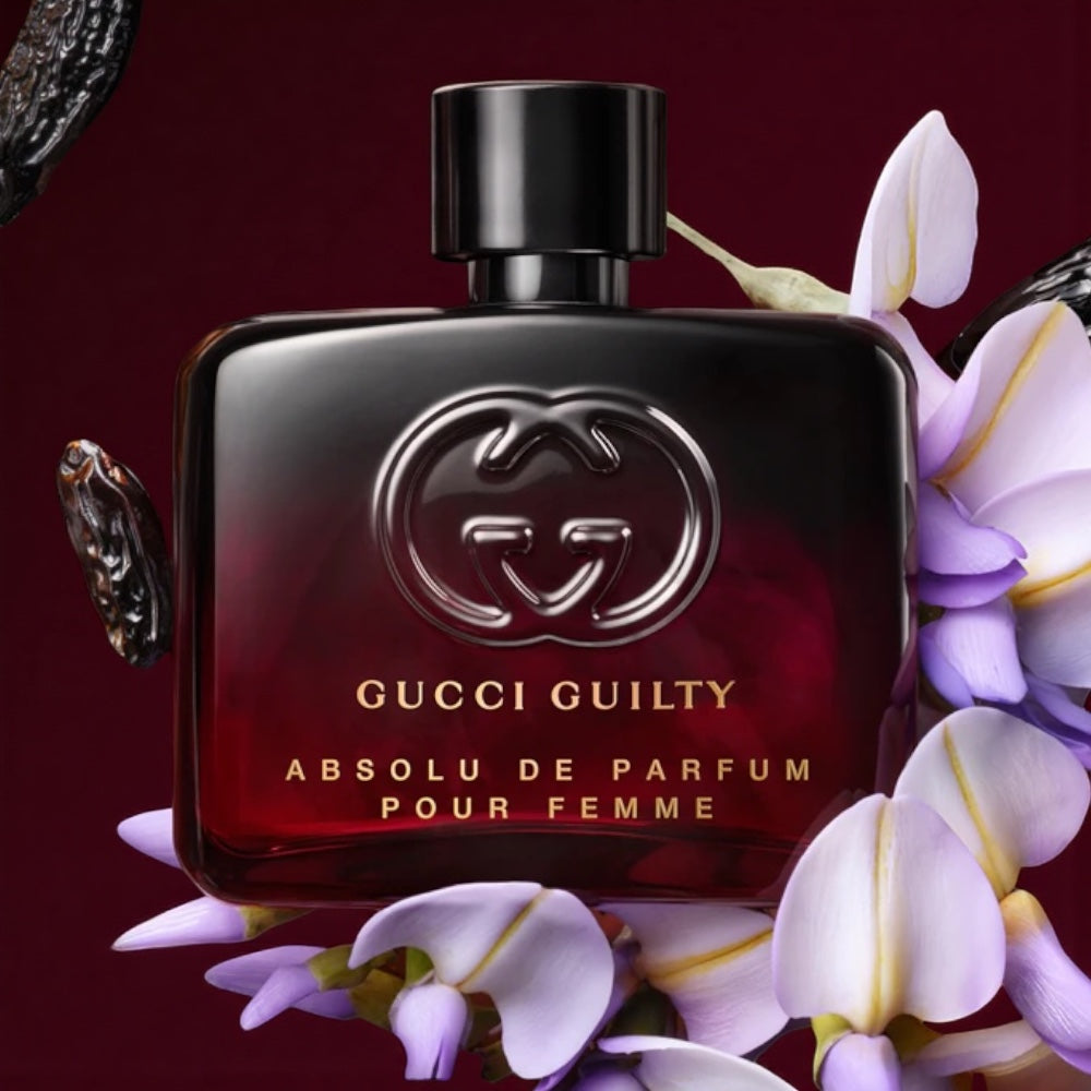 Gucci Guilty Absolu de Parfum Pour Femme perfume sample styled in a warm, moody scene to reflect its rose, patchouli, vanilla and coffee amaretto notes.