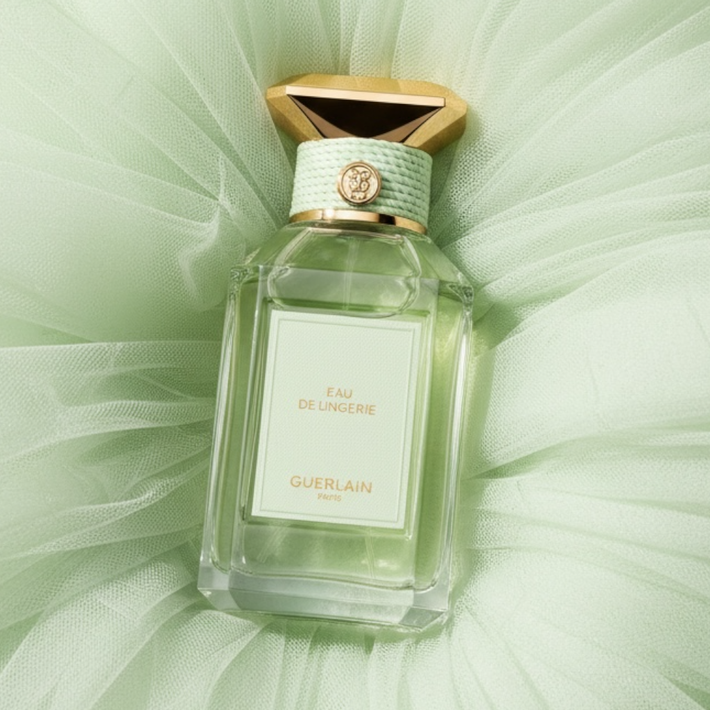 Guerlain Eau de Lingerie perfume styled in a soft, intimate satin setting