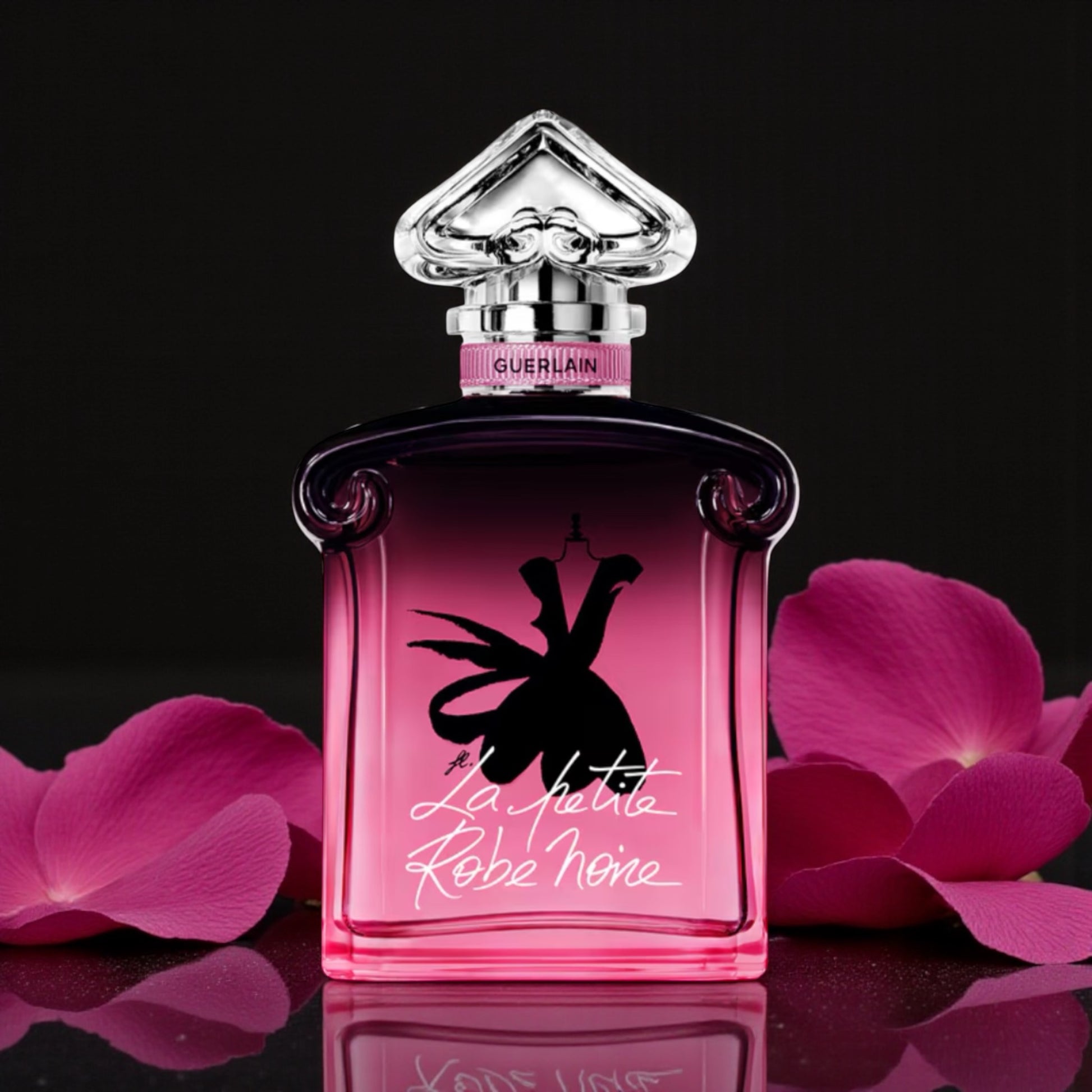 Guerlain La Petite Robe Noire Parfum perfume sample styled with dark elegant tones and rose petals to reflect its Parisian night time character.