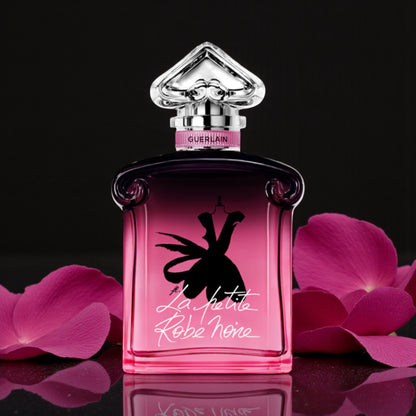 Guerlain La Petite Robe Noire Parfum perfume sample styled with dark elegant tones and rose petals to reflect its Parisian night time character.