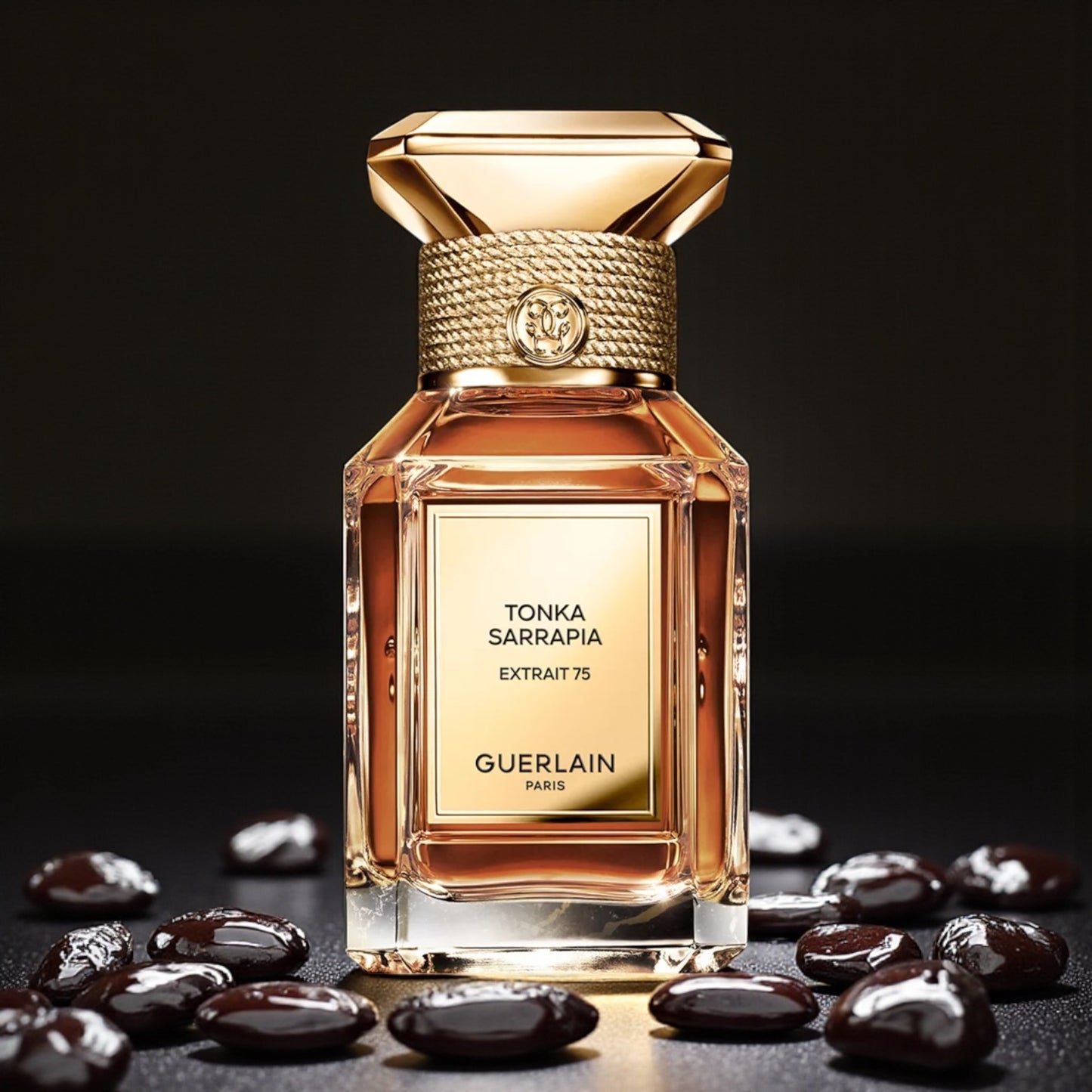 Guerlain Tonka Sarrapia Extrait 75 perfume sample styled with warm golden tones to reflect its deep ambery gourmand character.