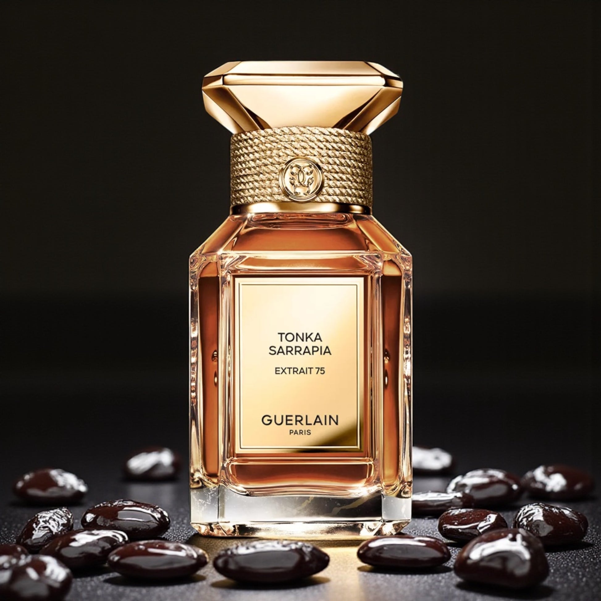 Guerlain Tonka Sarrapia Extrait 75 perfume sample styled with warm golden tones to reflect its deep ambery gourmand character.