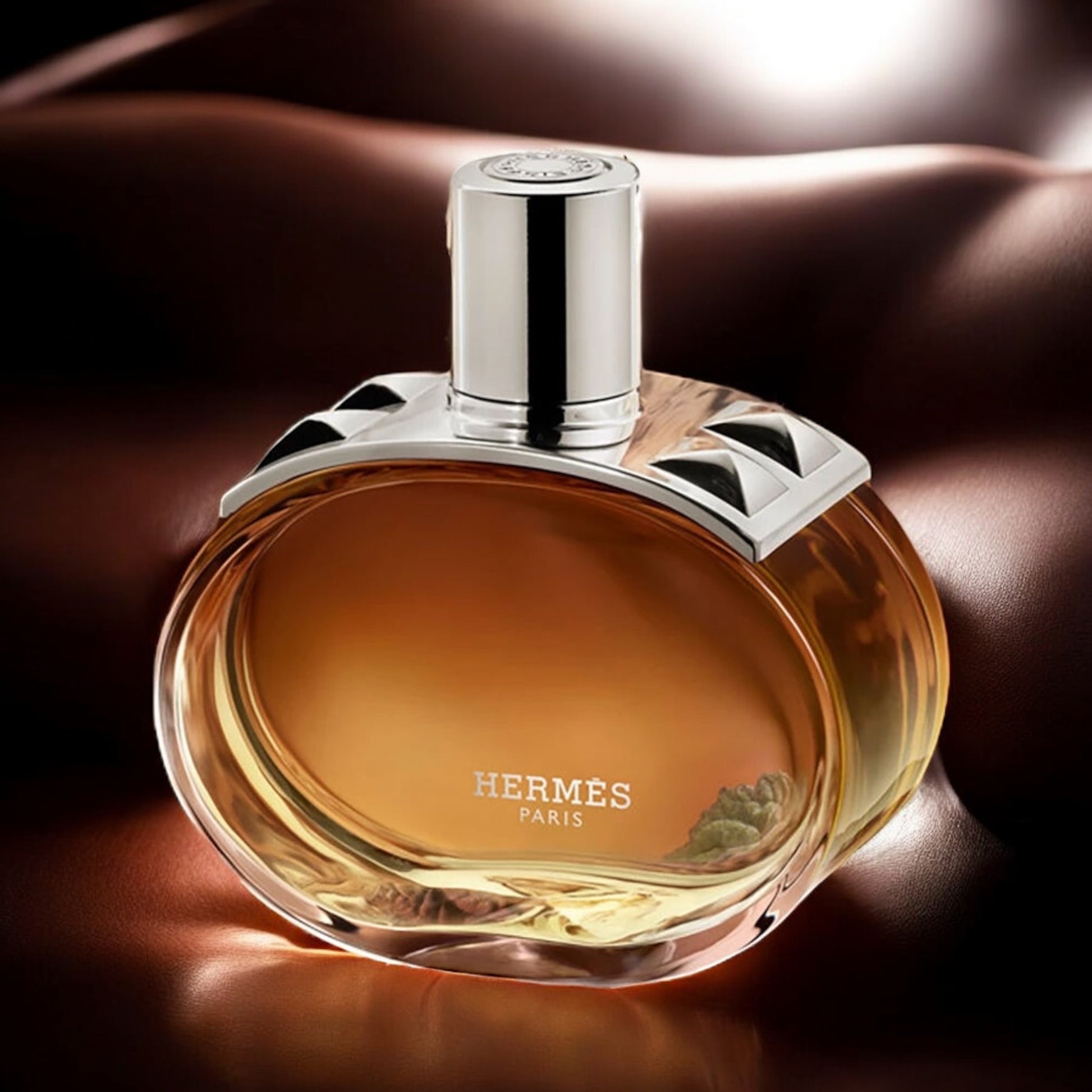 Hermès Barénia Intense perfume sample - elegant floral leather fragrance styled in a refined leather setting.