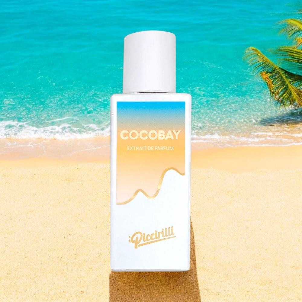 Cocobay perfume sample by I Piccirilli – tropical coconut fragrance set against a sunny beach with palm trees and ocean views.