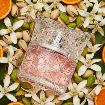 Issey Miyake Lumière d’Issey perfume styled in a sunlit Mediterranean-inspired setting with orange blossom nd pistachios