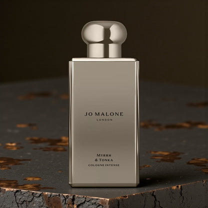 Jo Malone Myrrh & Tonka Cologne Intense perfume styled in a warm, atmospheric setting