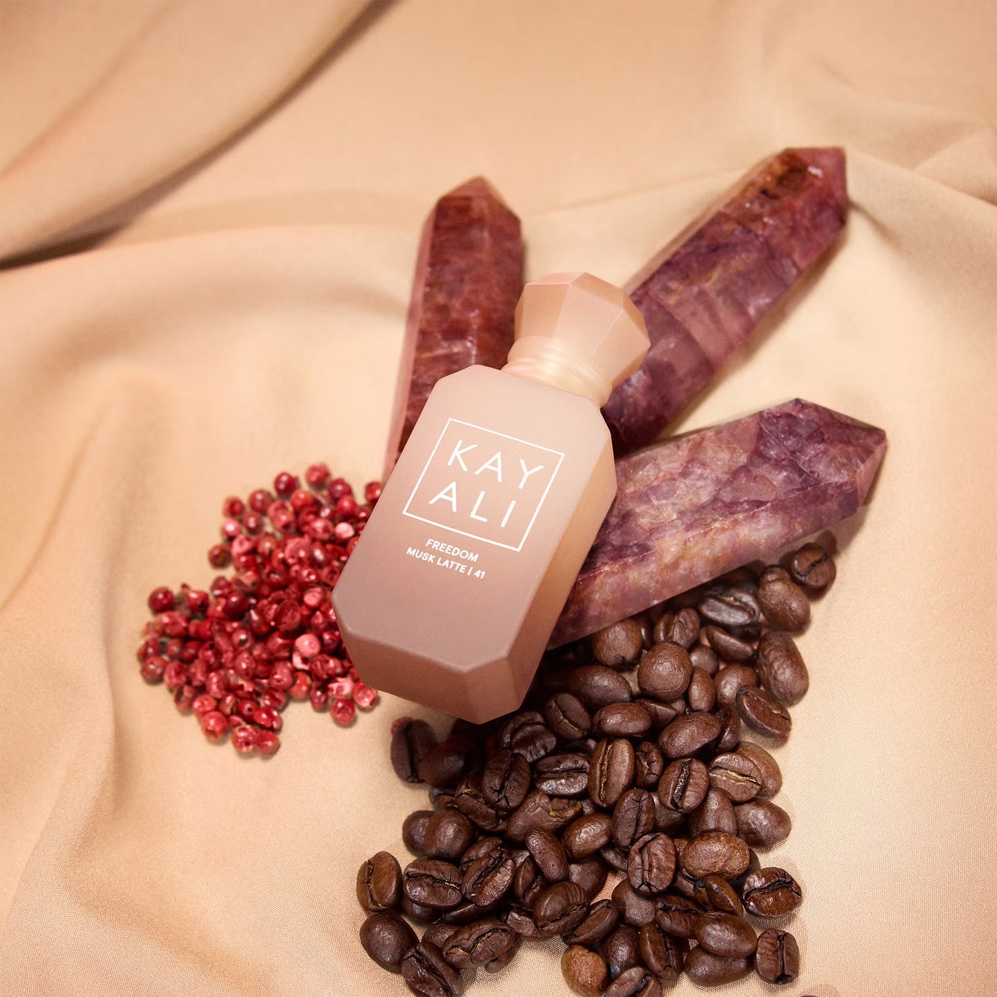 Kayali Freedom Musk Latte 41 perfume sample styled in a cosy café inspired setting to highlight its coffee, cinnamon and chocolate musk notes.