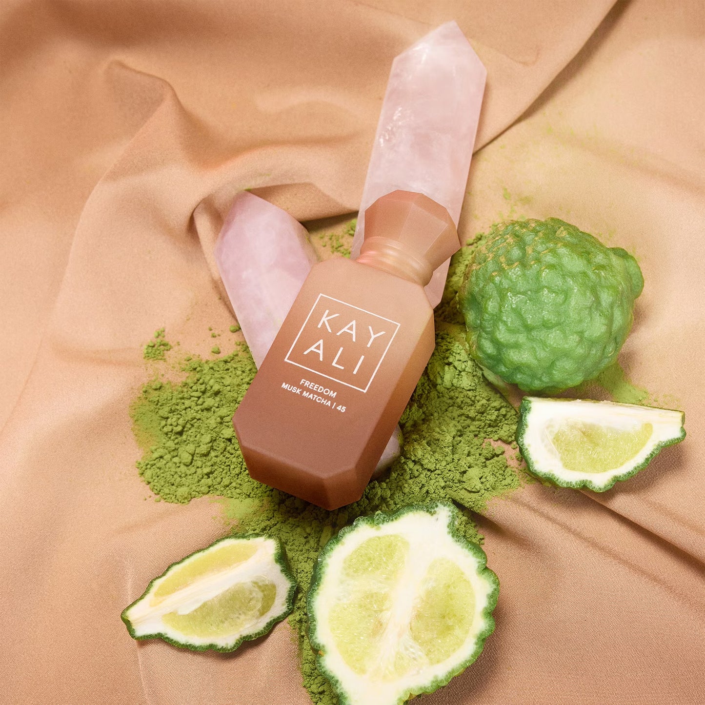 Kayali Freedom Musk Matcha 45 perfume sample styled in a soft grounding setting to highlight its matcha, oat milk and sweet musk notes.