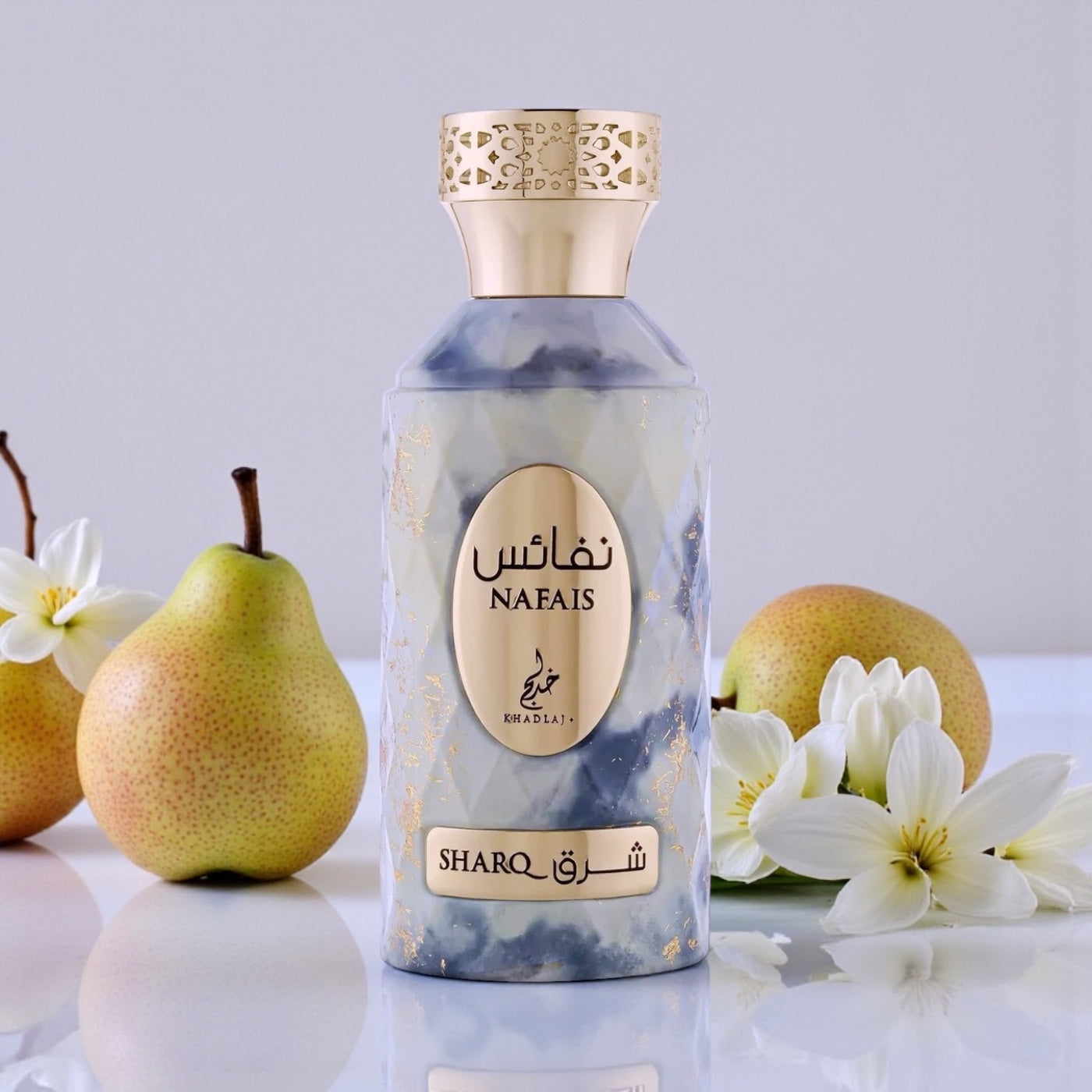 Khadlaj Nafais Sharq perfume styled in a warm, elegant setting with freesia and pear