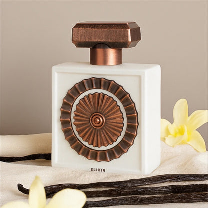 Lattafa Nebras Elixir perfume sample – creamy milk, vanilla and sugar notes styled in a soft, dessert-inspired setting.