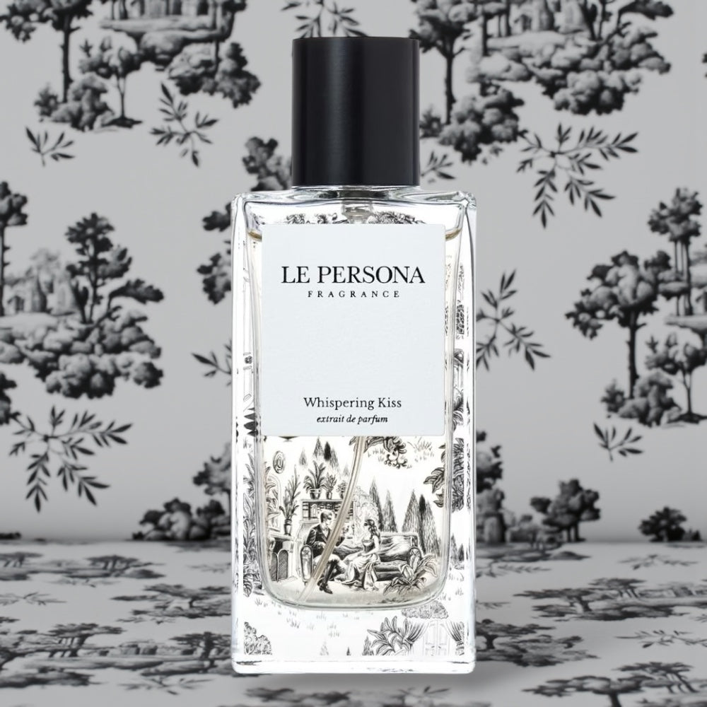 Le Persona Whispering Kiss perfume styled in a warm, intimate setting