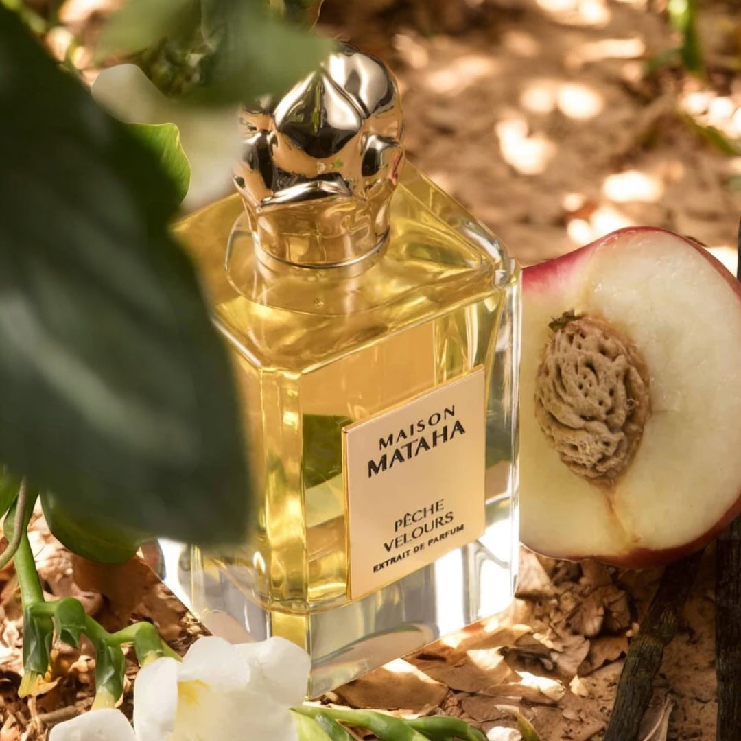 Maison Mataha Pêche Velours perfume sample - peach and floral scent styled in a soft, sunlit summer setting