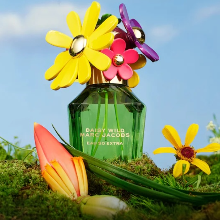 Marc Jacobs Daisy Wild Eau So Extra perfume styled in a vibrant, floral setting