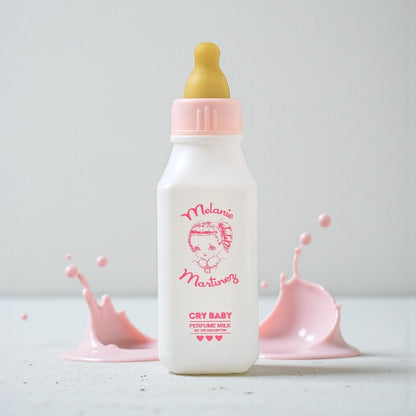 Martinez Cry Baby Perfume Milk perfume sample styled in a soft playful setting to reflect its strawberry milk, baby lotion and caramel notes.