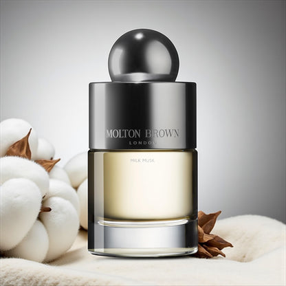 Molton Brown Milk Musk perfume sample – pear, musk and cedarwood notes styled in a soft, minimalist setting.