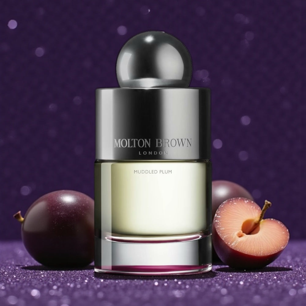 Molton Brown Muddled Plum perfume sample – plum, rum and saffron notes styled in a warm, festive setting.