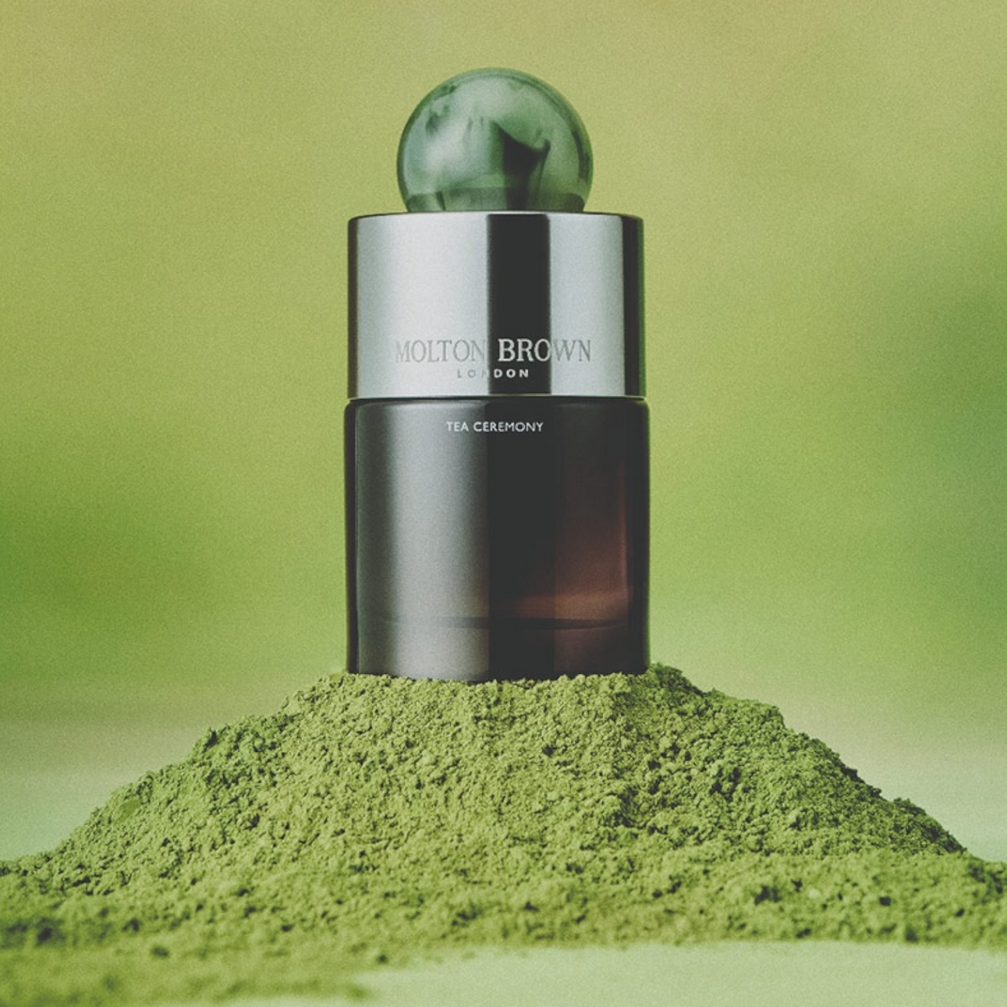 Molton Brown Tea Ceremony perfume styled with green matcha powder