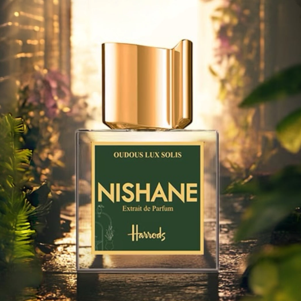 Nishane Oudous Lux Solis perfume sample – warm honeyed oud and tropical fruits, styled in a glowing, sunlit luxury setting