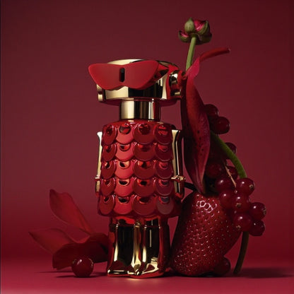 Rabanne Fame In Love perfume sample styled in soft pink and red tones to reflect its playful strawberry sweetness.