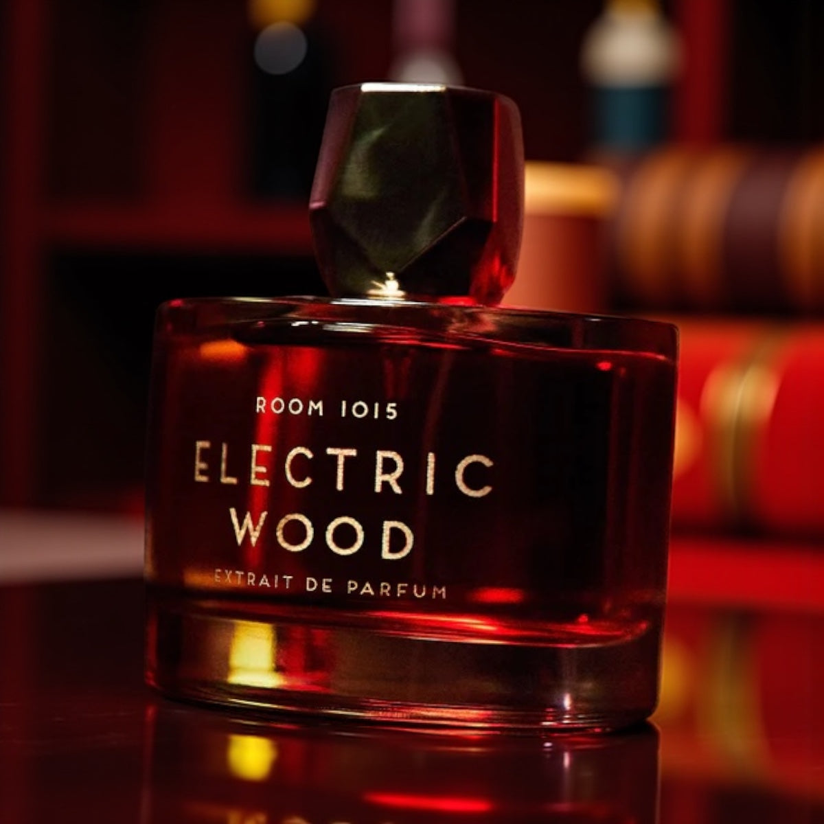 Room 1015 Electric Wood Extrait perfume sample – smoky wood, saffron, and myrrh notes styled in a dark rock-inspired setting.