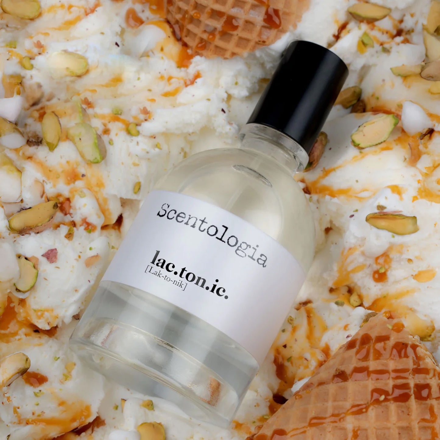 Scentologia Lactonic perfume sample – creamy milk, caramel, and pistachio notes styled in a soft, golden-toned setting.