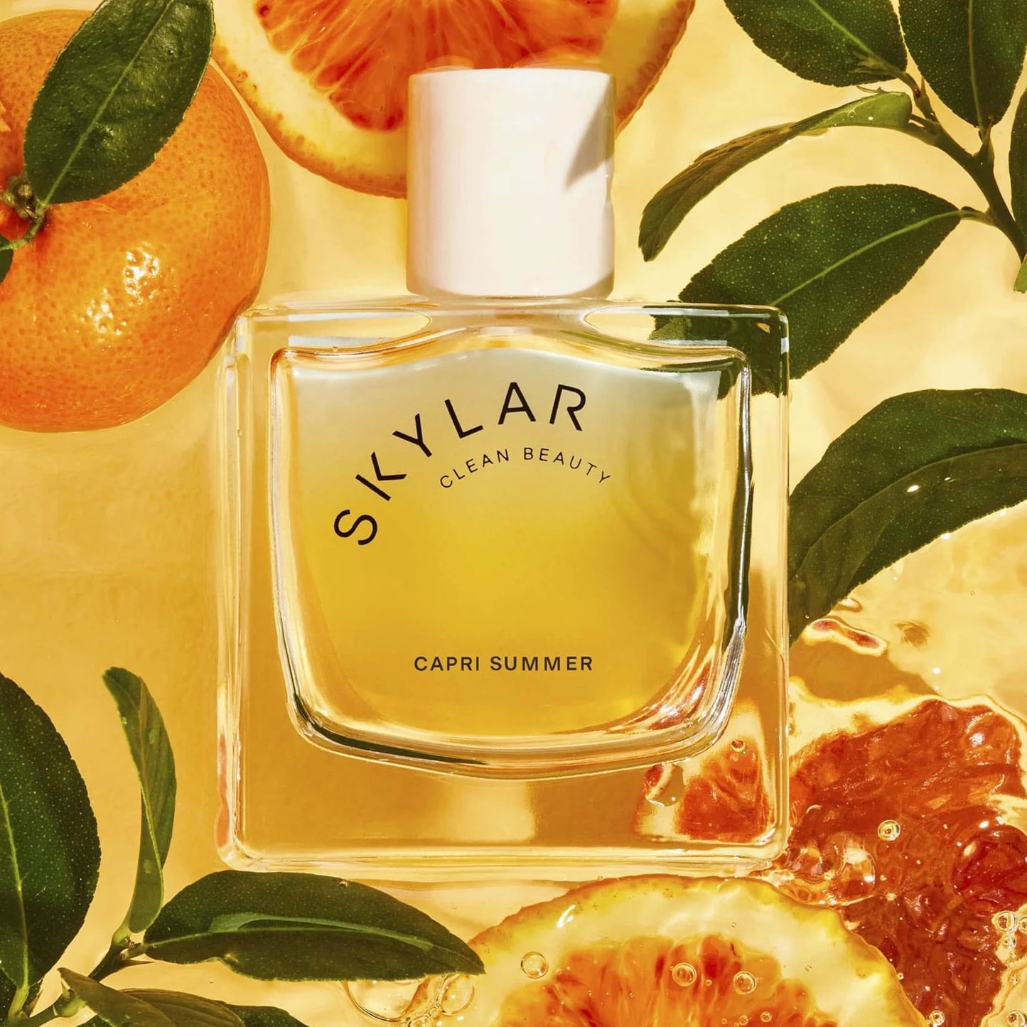 Skylar Capri Summer perfume sample – citrus, neroli and teakwood notes styled in a sunlit Mediterranean coastal setting.