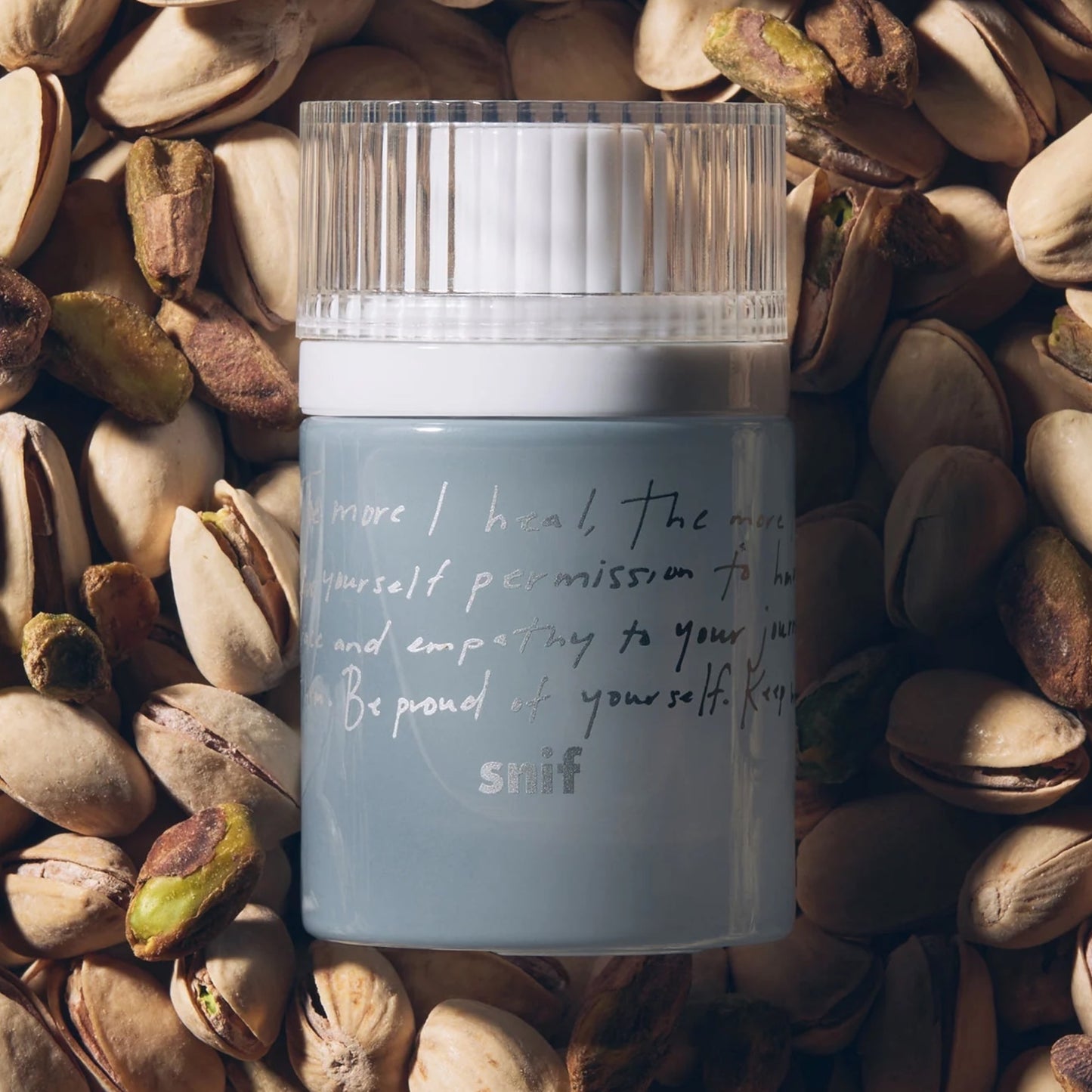 Snif Heal The Way perfume sample – warm, calming scent styled for a peaceful, self-care lifestyle setting