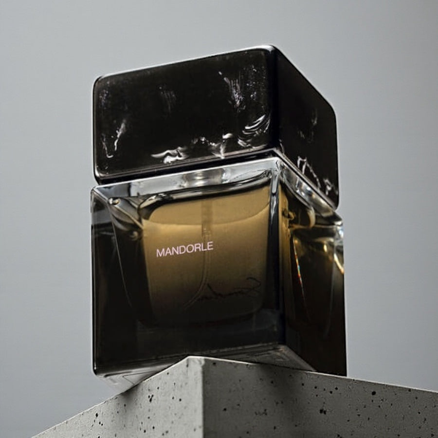 Sora Dora Mandorle perfume sample styled in a dark warm setting to highlight its almond, rum and suede notes.