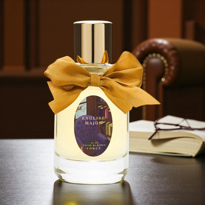 Sorce English Major perfume sample styled in a cosy bookish autumn scene to highlight its vanilla, fallen leaves and library book notes.