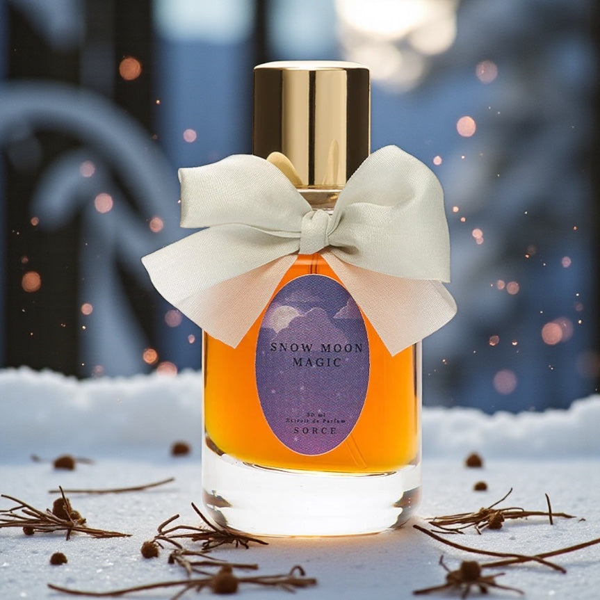 Sorce Snow Moon Magic perfume styled in a cozy winter setting