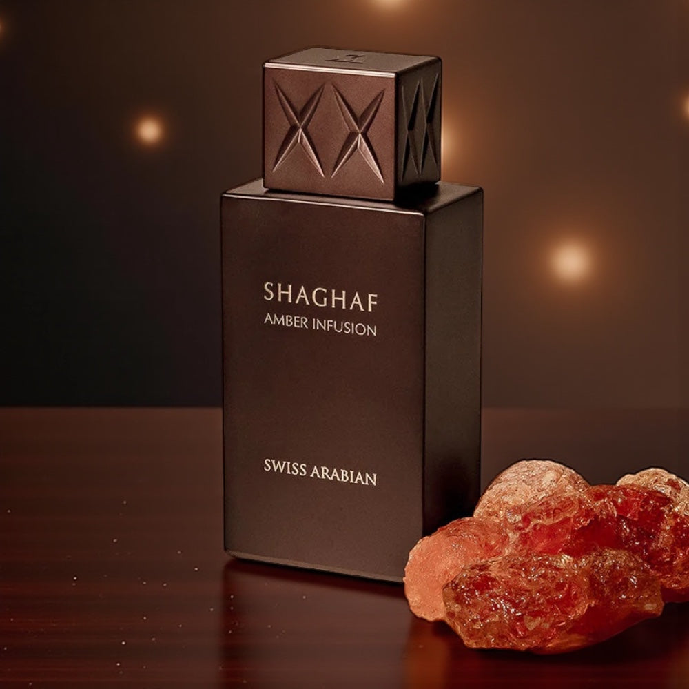 Swiss Arabian Shaghaf Amber Infusion perfume sample – amber, vanilla, and leather notes styled in a warm, golden-toned setting.