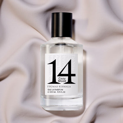 Thomas Kosmala Cozy Mood 14 perfume sample styled in a warm minimal setting to highlight its peach, plum and soft musk notes.
