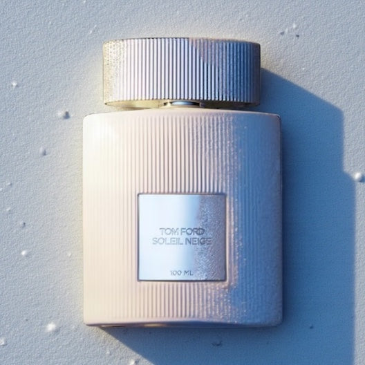 Tom Ford Soleil Neige perfume styled in a bright alpine-inspired frosty setting