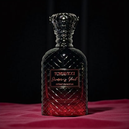 Tomavicci Siren’s Veil perfume sample – spiced plum, tobacco and amber wood notes styled in a moody dark-toned setting.
