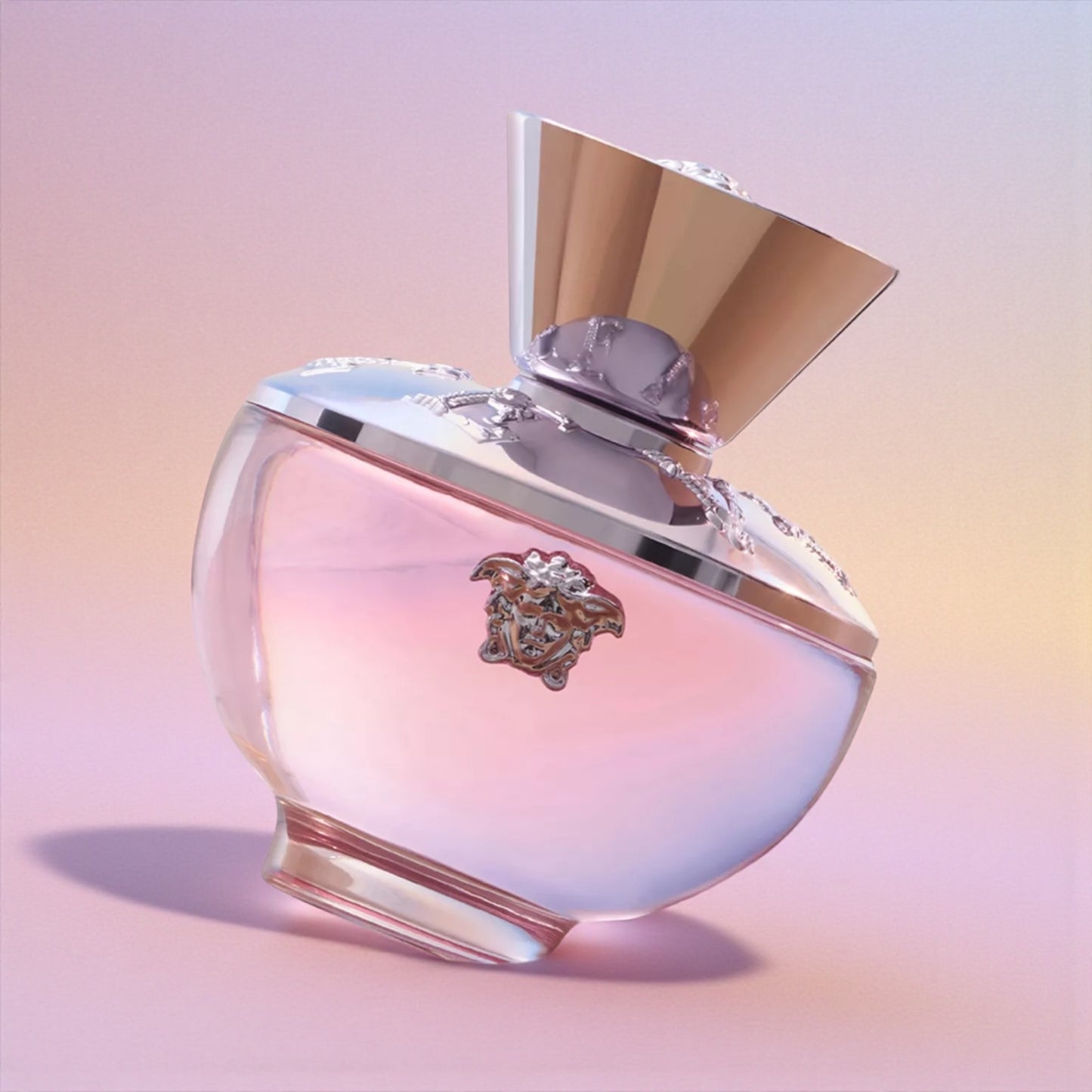 Versace Dylan Pink Blush perfume styled in a soft, romantic setting